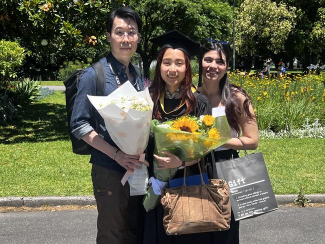 Lau Freeman, Zita Lam (Master of Information Systems) and Fatemeh Mirjalili at the University of Melbourne graduations held at the Royal Exhibition Building on Friday, December 13, 2024. Picture: Jack Colantuono