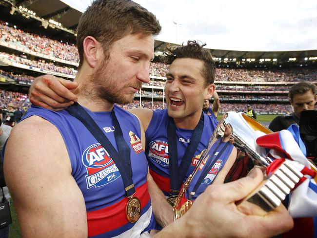 2016 AFL Grand Final match between the Western Bulldogs and the Sydney Swans at the Melbourne Cricket Ground (MCG), Melbourne, Australia on October 1, 2016. Western Bulldogs Luke Dahlhaus , and Western Bulldogs Matthew Boyd celebrate with the premiership cup Picture: David Caird