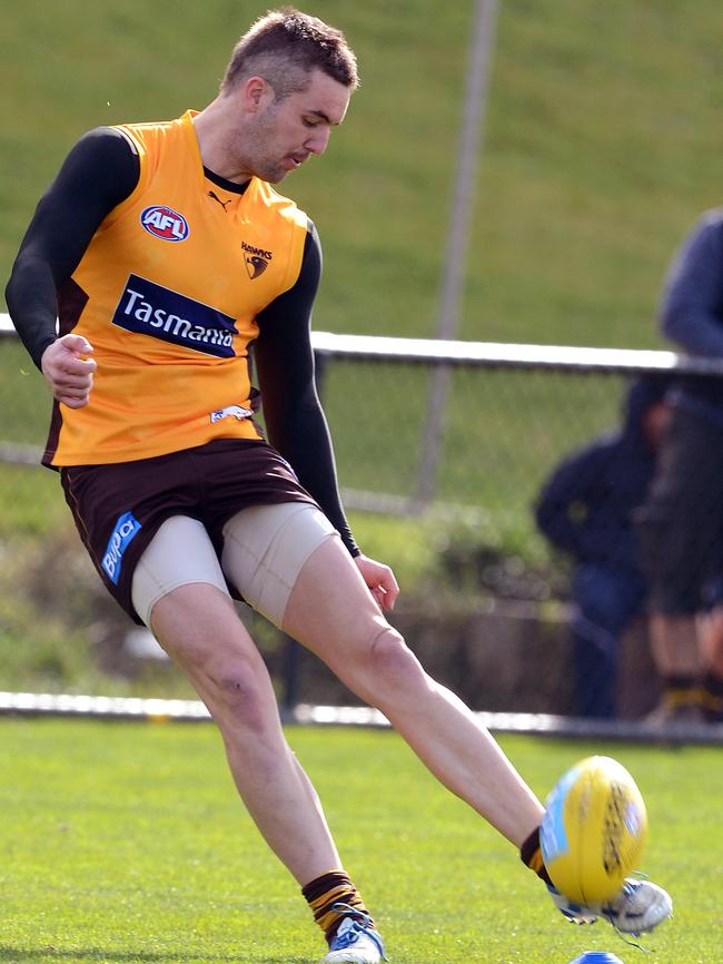 Matt Suckling tries a place kick at training during his time at Hawthorn.