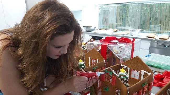 Melina Sehr working on a gingerbread house in 2020. Picture: Facebook