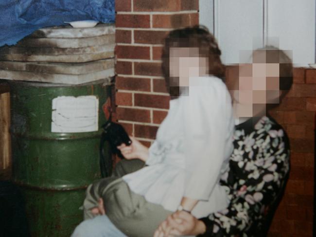 Guests at a party with a green barrel in background that held the body of Edwina Boyle. Picture: Trezise Paul