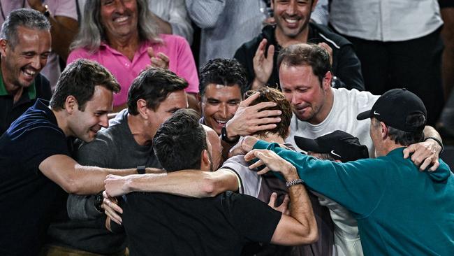 Italy's Jannik Sinner celebrates with his team after victory against Russia's Daniil Medvedev.