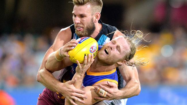 Daniel Rich gets tackled by Jackson Trengove. Picture: Getty Images