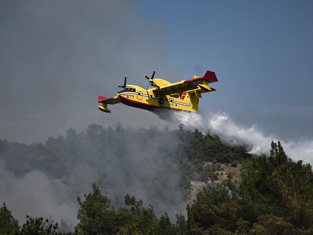 A Canadair amphibious aircraft, drops water over wildfires spreading in Dadia forest, near Alexandroupoli, north Greece. Picture: AFP