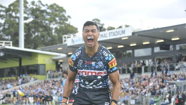 Cronulla Sharks winger Ronaldo Mulitalo celebrates a try against the Gold Coast Titans at C.ex Stadium Coffs Harbour. Photo: Tim Jarrett