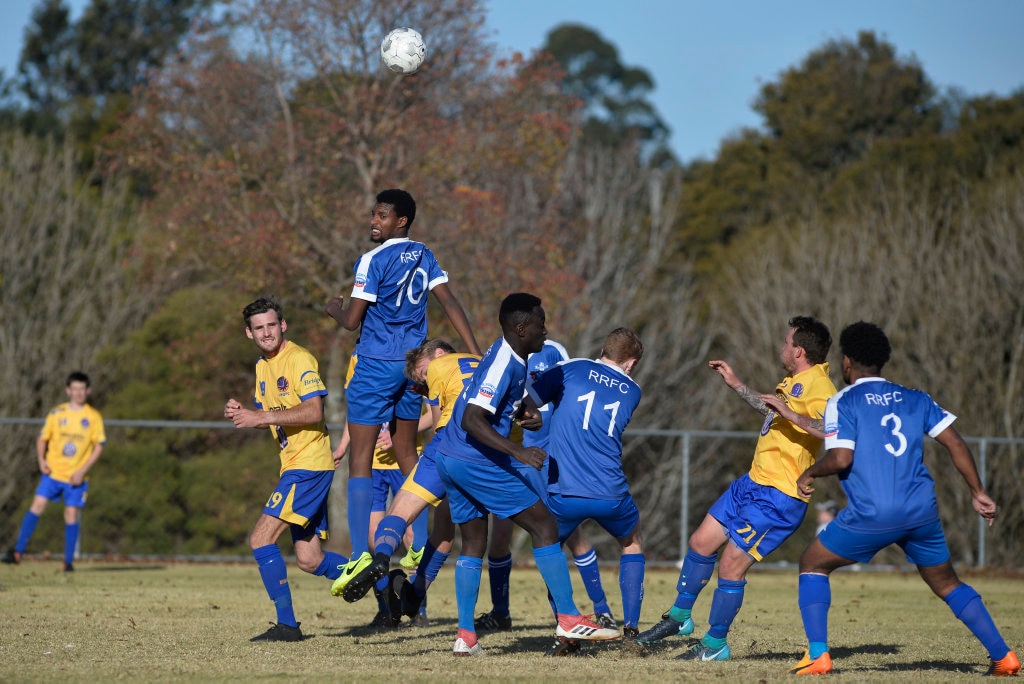 Veco Serugo heads the ball for Rockville against USQ FC in Toowoomba Football League Premier Men round 14 at Captain Cook Reserve Des McGovern oval, Sunday, June 24, 2018. Picture: Kevin Farmer