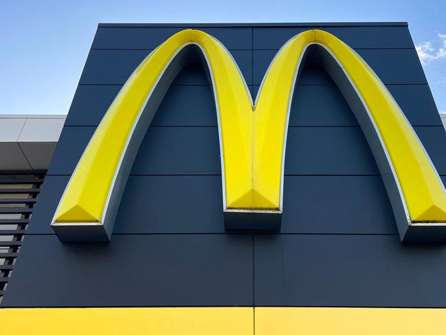 A McDonald's emblem adorns the front of one of their outlets in Sydney on July 4, 2024. McDonald's fast-food outlets in Australia have cut breakfast service hours as bird flu outbreaks around the country hit egg supplies. (Photo by DAVID GRAY / AFP)