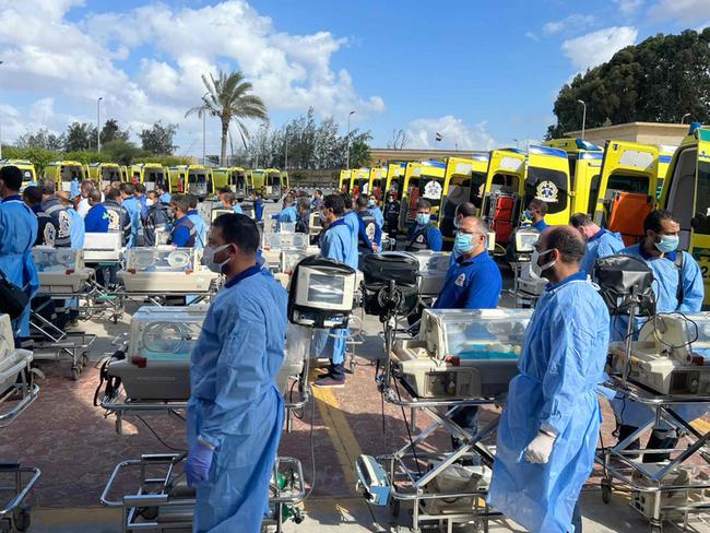 Egyptian medics stand by with incubators to receive premature Palestinian babies evacuated from Gaza on the Egyptian side of the Rafah border crossing with the Gaza Strip. Picture: AFP