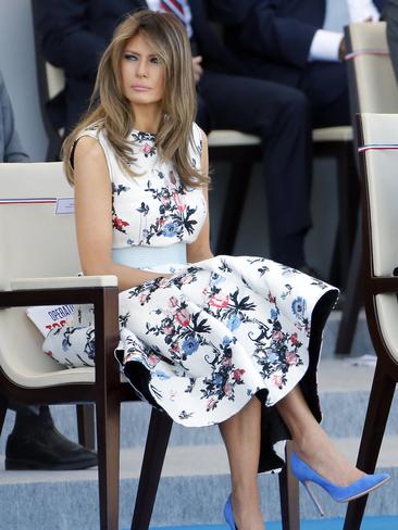 JULY 14: Still in France, the First Lady chose Italian designer Valentino’s floral frock to attend the traditional Bastille day military parade on the Champs-Elysees. Picture: Getty