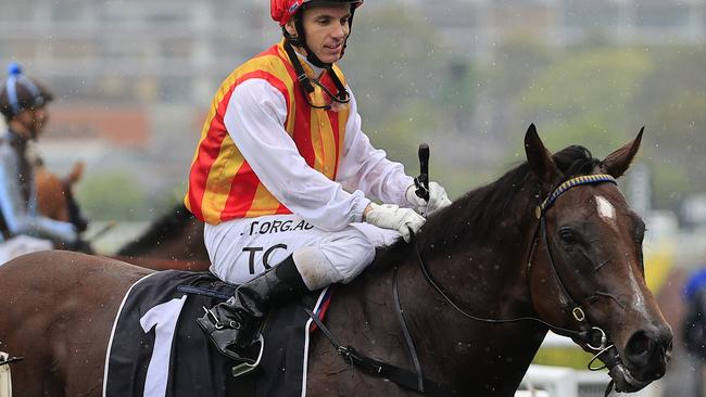 Tim Clark returns to scale on Peltzer after winning the Bondi Stakes at Randwick. Picture: Getty Images