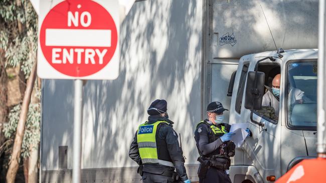 Victoria Police stopping vehicles at the Chiltern Park rest area on Sunday. Picture: Simon Dallinger