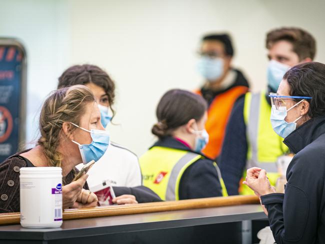 Arrivals into Hobart Airport going through Covid screening procedures with Biosecurity Tasmania. Picture: MATHEW FARRELL