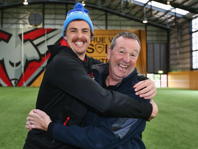MELBOURNE, AUSTRALIA - JUNE 05:  Bombers legend Neale Daniher (R) gets a hug from nephew Joe Daniher of the Bombers after a cheque presentation to fight MND at the Essendon Football Club  on June 5, 2017 in Melbourne, Australia. Neale Daniher, a sufferer of Motor Neurone Disease, is helping to raise funds to fight the disease.  (Photo by Michael Dodge/Getty Images)