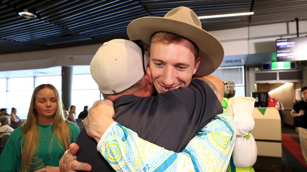 Paralympian Gold Medallist Korey Boddington arrives home in Brisbane to parents Elizabeth Chapel and dad Paul (pictured) and partner Chloe Burton after competing in Paris. Pics Adam Head