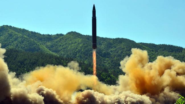 TOPSHOT — This picture taken on July 4, 2017 and released by North Korea's official Korean Central News Agency (KCNA) on July 5, 2017 shows the successful test-fire of the intercontinental ballistic missile Hwasong-14 at an undisclosed location. South Korea and the United States fired off missiles on July 5 simulating a precision strike against North Korea's leadership, in response to a landmark ICBM test described by Kim Jong-un as a gift to "American bastards". / AFP PHOTO / KCNA VIA KNS / STR / South Korea OUT / REPUBLIC OF KOREA OUT ---EDITORS NOTE--- RESTRICTED TO EDITORIAL USE — MANDATORY CREDIT "AFP PHOTO/KCNA VIA KNS" — NO MARKETING NO ADVERTISING CAMPAIGNS — DISTRIBUTED AS A SERVICE TO CLIENTS THIS PICTURE WAS MADE AVAILABLE BY A THIRD PARTY. AFP CANNOT INDEPENDENTLY VERIFY THE AUTHENTICITY, LOCATION, DATE AND CONTENT OF THIS IMAGE. THIS PHOTO IS DISTRIBUTED EXACTLY AS RECEIVED BY AFP. /