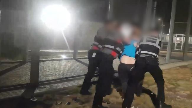 The man can be heard screaming as he is pinned to the ground.