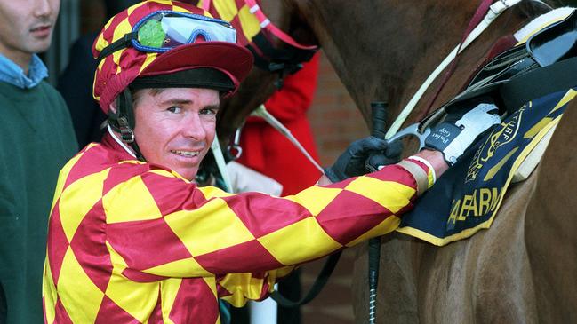 Brent Thomson unsaddles a horse at Eagle Farm in 1997.