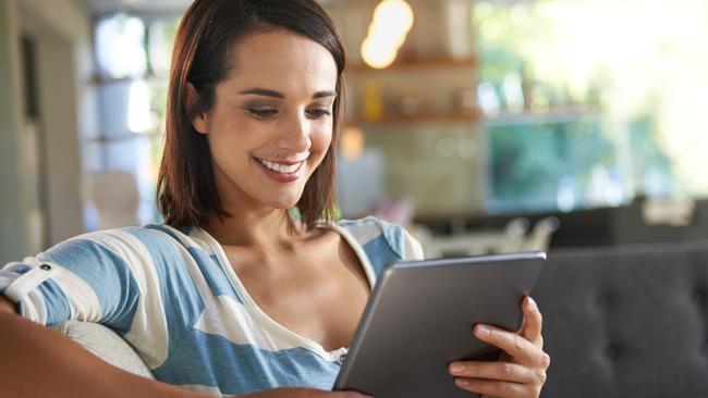 Shot of an attractive young woman relaxing at home with a digital tablethttp://195.154.178.81/DATA/istock_collage/0/shoots/784332.jpg