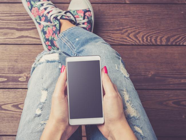 Generic photo of girl with a phone, for SA Weekend column by Mark Dapin. Picture: iStock