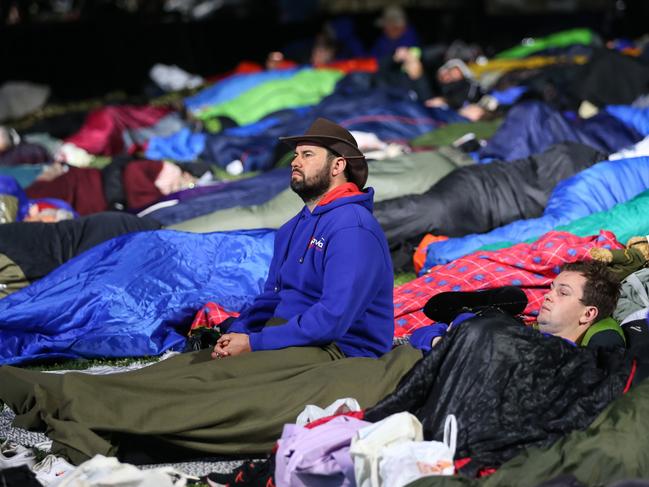 About 500 Australians and New Zealanders crossing from Canakkale city to the Gallipoli Peninsula at night with sleeping bags and blankets waited for the Dawn Service by watching a documentary on the battles on the giant screen set up in the ceremony area. Picture: Getty Images