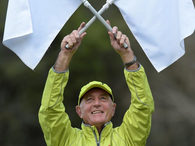 Martien Pruysers of Ferntree Gully has been field and goal umpiring for 40 years and just brought up his 1800th game. Martien prepares for his next game at Bayswater oval.