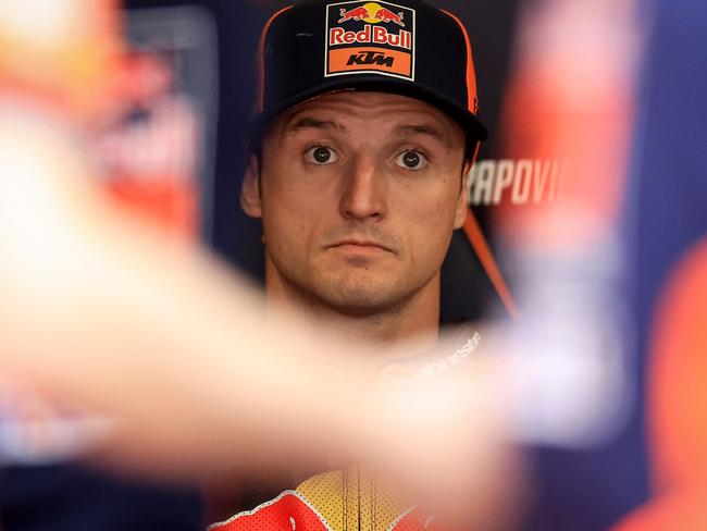 KTM Australian rider Jack Miller looks on in the box ahead of the MotoGP qualifying session of the Portuguese Grand Prix at the Algarve International Circuit in Portimao on March 23, 2024. (Photo by PATRICIA DE MELO MOREIRA / AFP)