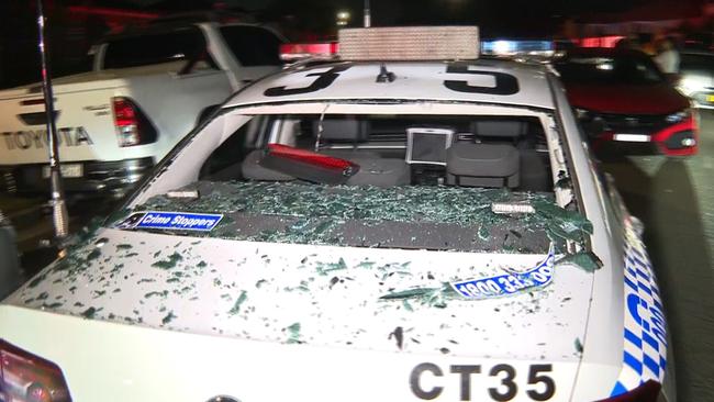 A police car was vandalised during the riots. Picture: TNV