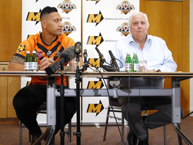 Israel Folau and Clive Palmer during a media conference in Brisbane.