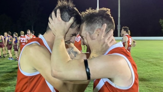 James Malone and Shaun Connor celebrate the Yeppoon Swans' grand final win over the Glenmore Bulls on Saturday. Photo: Pam McKay