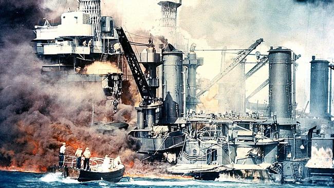 The USS West Virginia burning after the Japanese attack on Pearl Harbor, Hawaii in 1941.