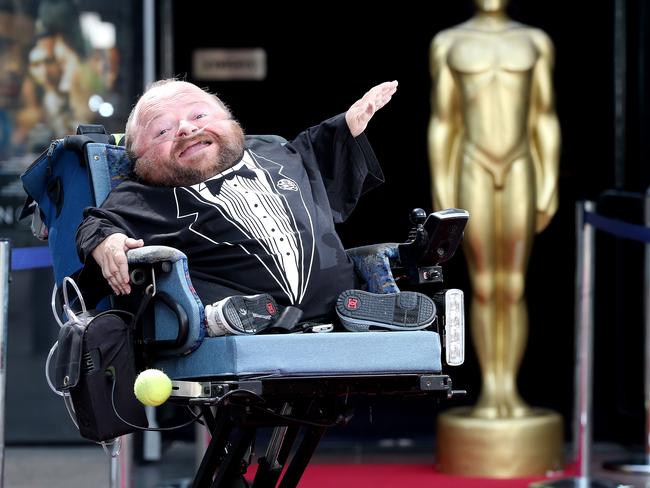 Quentin Kenihan practices for the Oscars red carpet in front of the Palace Nova Cinema. Photo: Calum Robertson