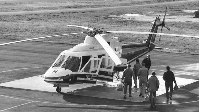 Let the good times roll again: Oil rig workers board a helicopter at the Longford heliport, East Gippsland, for a flight to an offshore rig in 1985.