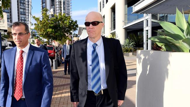 Mark Thompson (right), a former Dreamworld safety manager, leaves after giving evidence to the inquest into the Dreamworld disaster at the Magistrates Court at Southport on the Gold Coast, Monday. (AAP Image/Dan Peled)