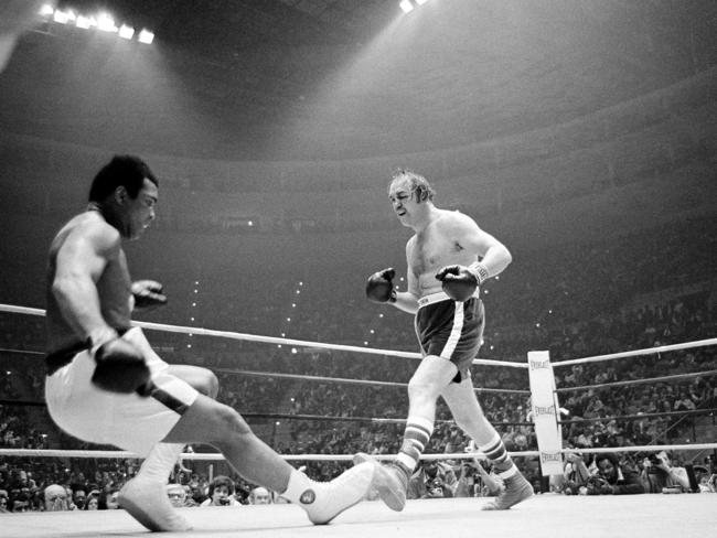 Muhammad Ali going down in the ninth round of the title bout against challenger Chuck Wepner in 1975. Picture: AP Photo