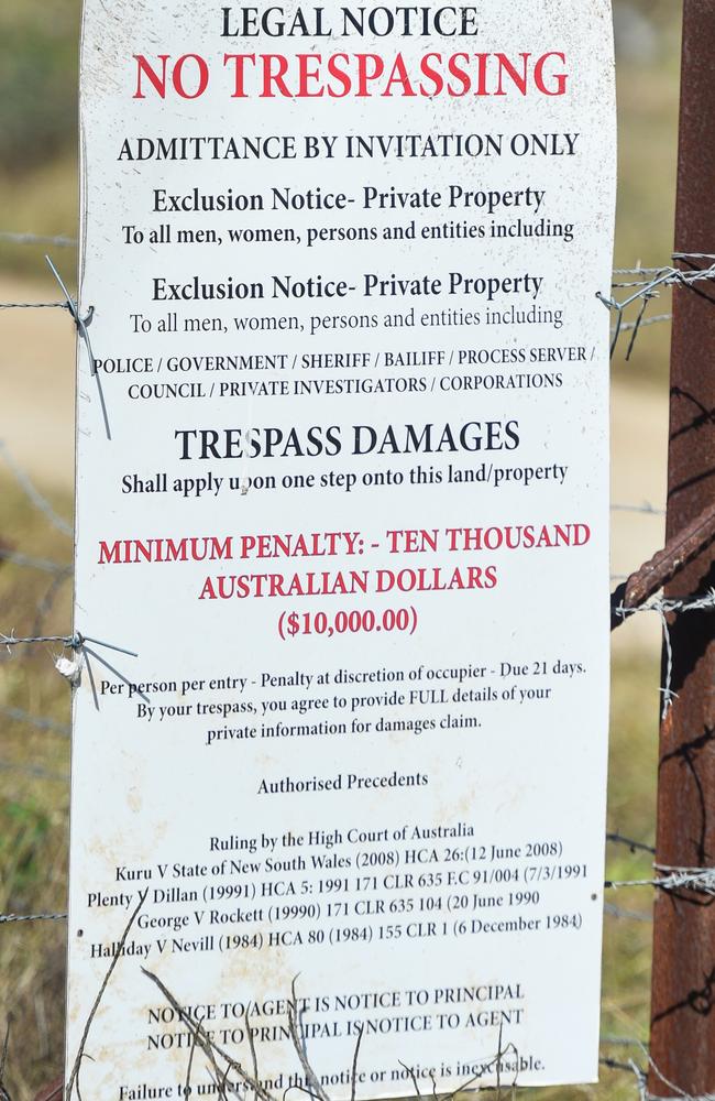 A sign on triple murder-accused Darryl Young’s property outside Bowen.