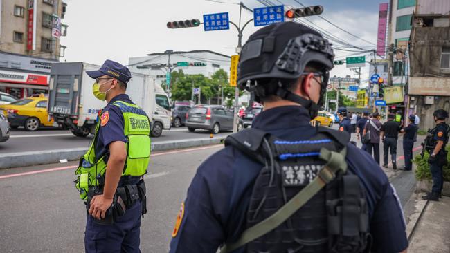 Police stand guard before Nancy Pelosi’s arrival of at the Jingmei Human Rights Cultural Park in Taipei. Picture: Getty Images.