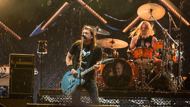 Dave Grohl (left) and Taylor Hawkins performing in Geelong on Friday, March 4 2022, shortly before Hawkins’ sudden death, aged 50. Picture: Brett Schewitz / Frontier Touring