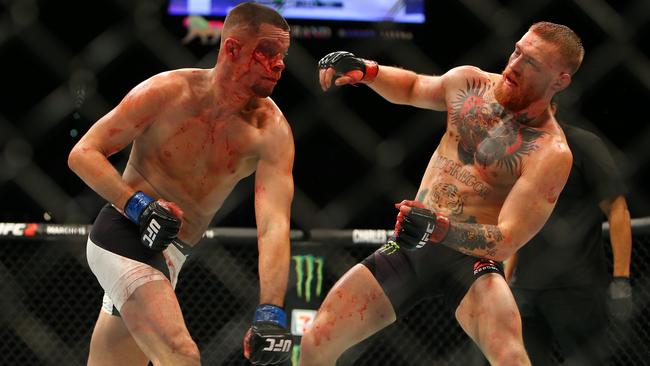 Nate Diaz hits Conor McGregor with a decisive punch before a failed uppercut during UFC 196.