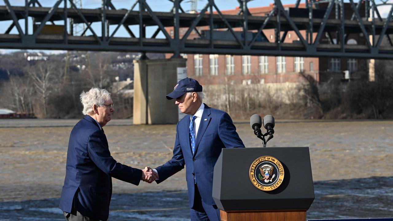 Joe Biden shakes hands with Mitch McConnell in front of the Brent Spence Bridge in Kentucky. Picture: Jim Watson/AFP