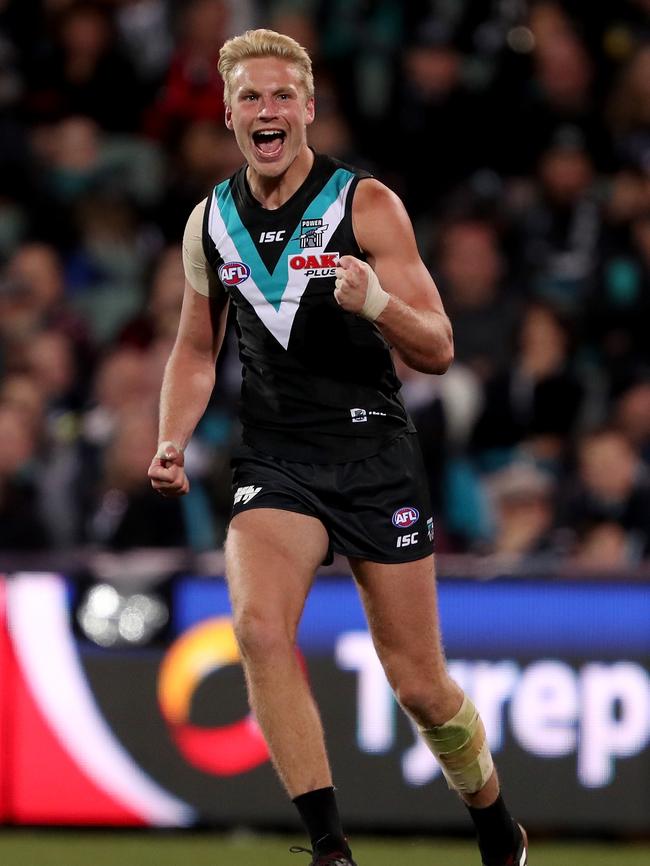 Port tall Billy Frampton celebrates his first AFL goal on Friday. Can he become a Power regular? Picture: James Elsby/AFL Media/Getty Images