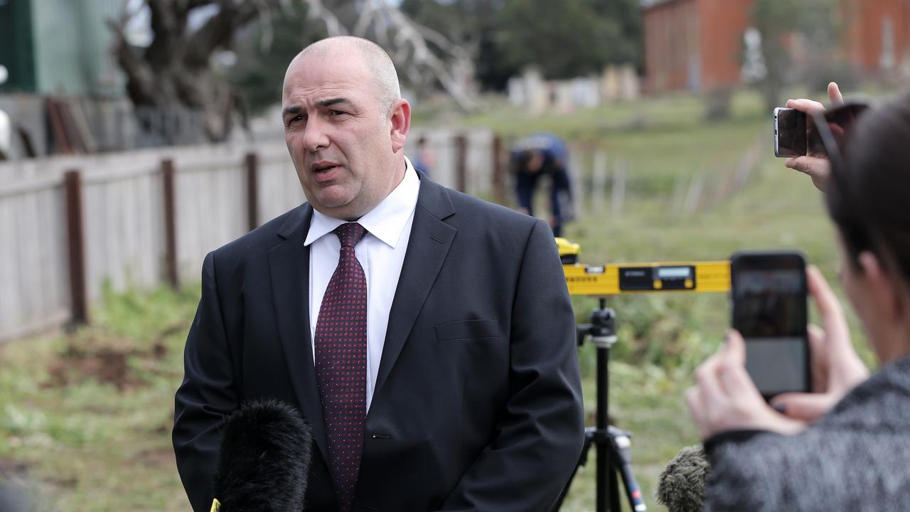 Tasmania Police search for bullet casings in the field in East Street, Campbell Town, adjacent to the residence where Shane Barker was killed in 2009. Detective Sergeant Mark Lopes speaks to media at the search location Picture: LUKE BOWDEN