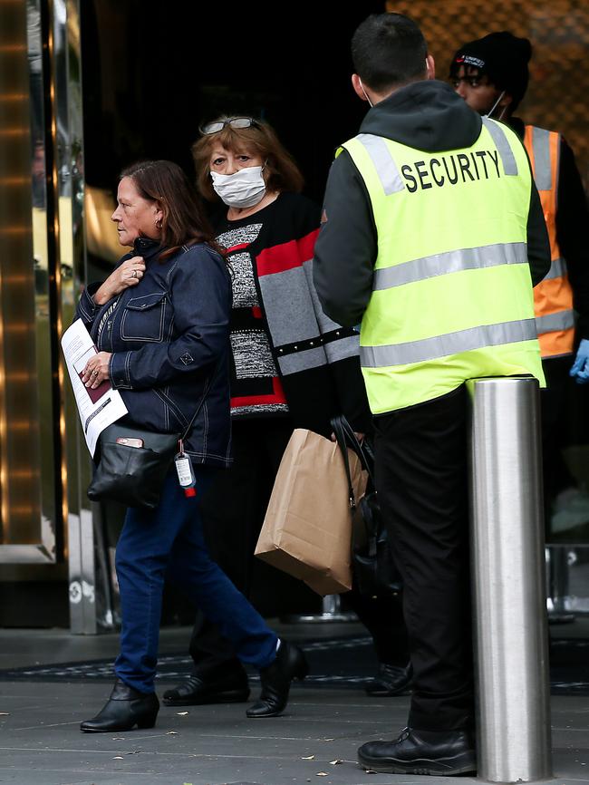 Travellers leave the Crown Promenade Hotel in Melbourne after spending 14 days in quarantine. Picture: Ian Currie