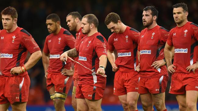 Dejected Wales players look on after their loss to the Wallabies.
