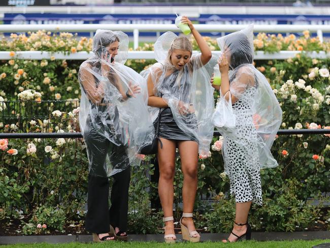 Derby Day at Flemington Racecourse. Revellers enjoying the day despite the rain.    Picture: Alex Coppel.