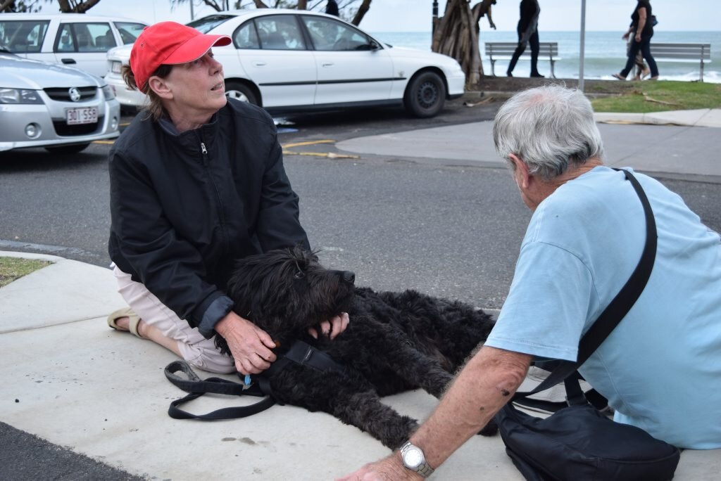 SAD DAY: Brenda and Brian Abbey comfort their dog Archie after he collapsed from a seizure at Mooloolaba Beach on Saturday, June 13. Photo Nicky Moffat / Sunshine Coast Daily. Picture: Nicky Moffat