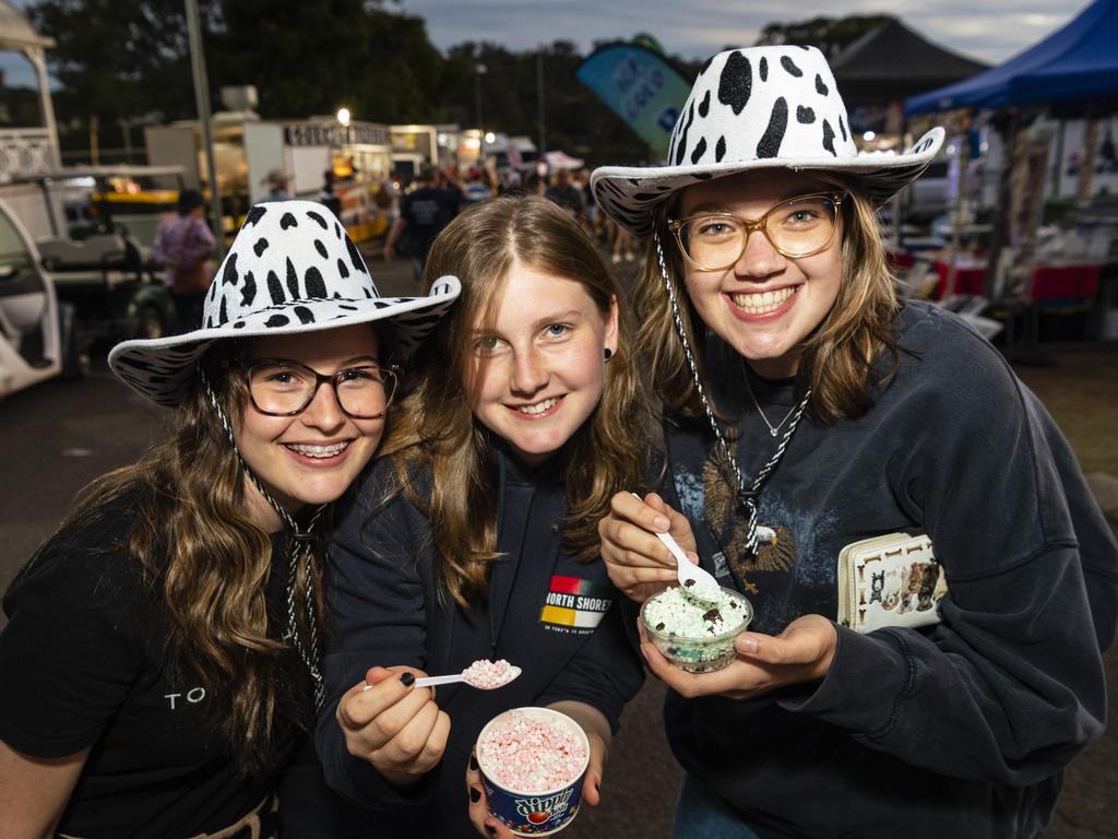 Enjoying a show treat are (from left) Vaeda Griggs, Adele Smith and Bethany Griggs at the Toowoomba Royal Show, Friday, March 31, 2023. Picture: Kevin Farmer