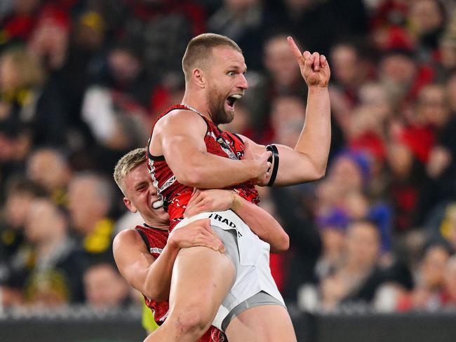 MELBOURNE, AUSTRALIA - MAY 25: Nate Caddy and Jake Stringer of the Bombers celebrate a goal during the round 11 AFL match between Richmond Tigers and Essendon Bombers at Melbourne Cricket Ground, on May 25, 2024, in Melbourne, Australia. (Photo by Morgan Hancock/AFL Photos/via Getty Images)