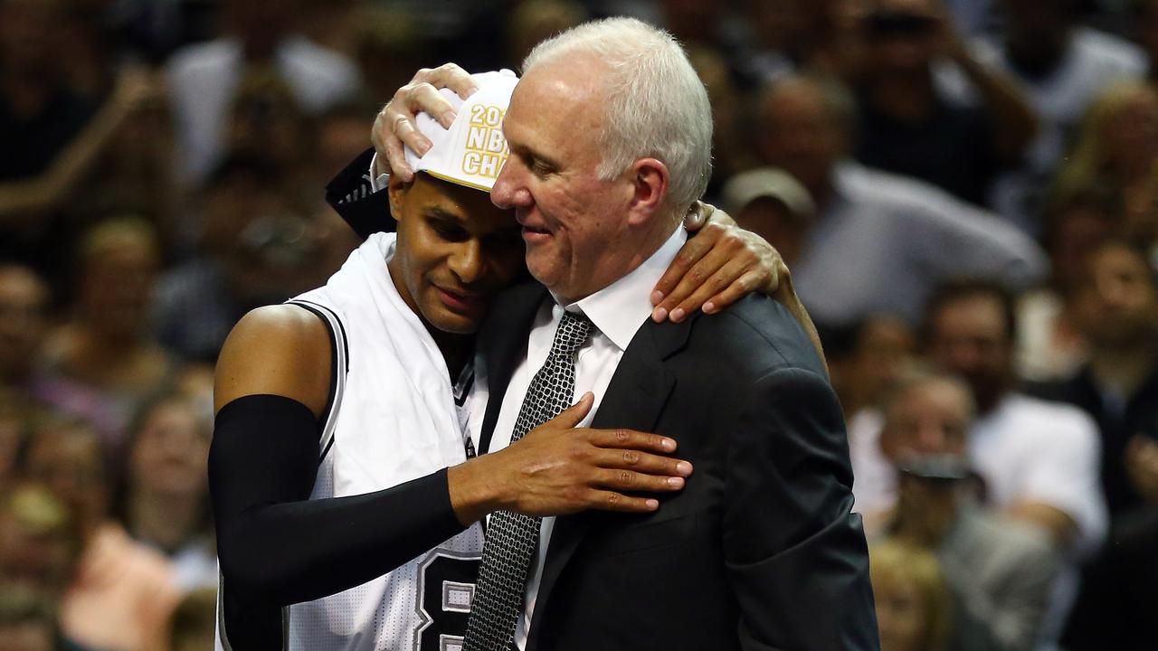 Gregg Popovich celebrates with Patty Mills after San Antonio Spurs after defeated the Miami Heat in Game Five of the 2014 NBA Finals. Picture: Andy Lyons/Getty Images