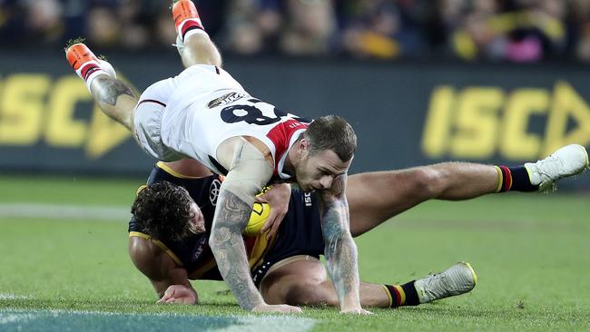 St Kilda forward Tim Membrey dives over the top of Adelaide defender Kyle Hartigan. Picture: Sarah Reed