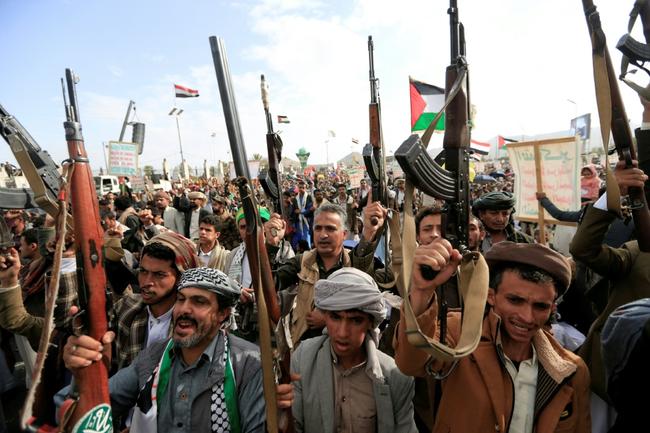 Supporters of Yemen's Huthis raise their rifles during an anti-Israel rally in solidarity with Gaza and Lebanon in the Huthi-controlled capital Sanaa